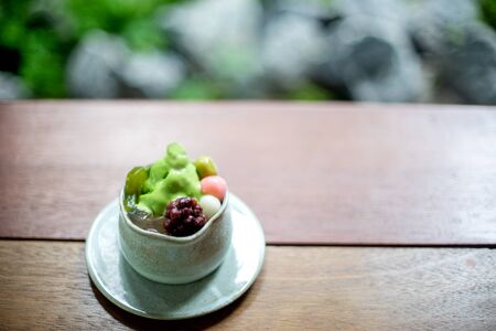 japan dessert food in the ceramic cup on wood table, with blur background in restaurant.の写真素材