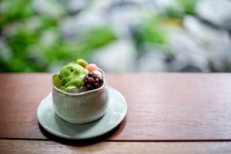 japan dessert food in the ceramic cup on wood table, with blur background in restaurant.の写真素材