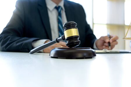 In the office of Judge or lawyer, there are balance and gavel on the table. Law firm Concept.の写真素材