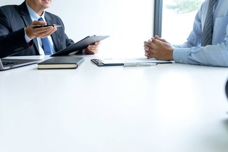 Businessman group in office, young asian people sit and speaking with resume while interviewing as candidate for job in big company. career and recruitment concept