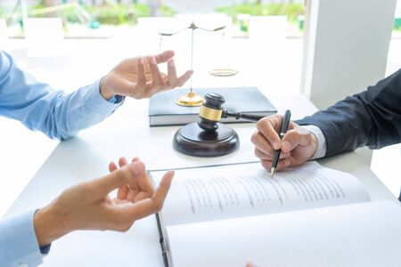 in office  Lawyer or judge gavel with balance work with client or customer about agreement how to  use arbitrationの写真素材