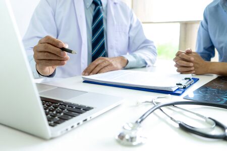 Doctor sit with patient talk consultant discuss about health care for good life.の写真素材