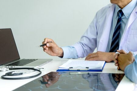 Doctor sit with patient talk consultant discuss about health care for good life.の写真素材