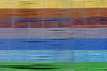 Outdoor multi color wall rustic iron sheet , sun light in front of the buildingの写真素材