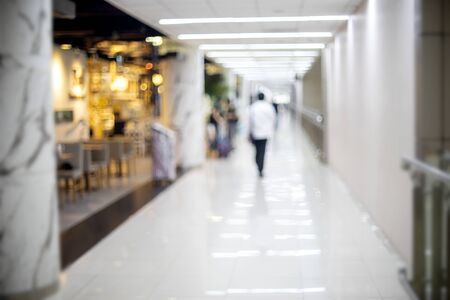 Blur walk way in the airport , in the shop and food or restaurant areaの写真素材