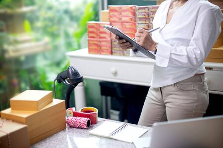 woman work for export business, pack and paper workの写真素材