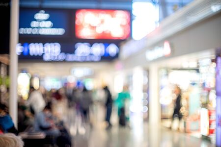 Blur image of People walk rushing in airport shopping tax free area, Blurred backgroundの写真素材
