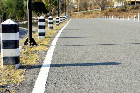 street road way, in the background green tree and hill level の写真素材