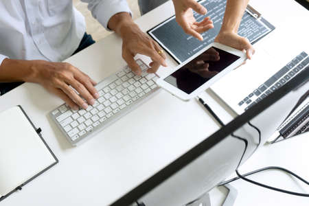 On the table in the law office business people talk about law paper, gavel and scale are on the...