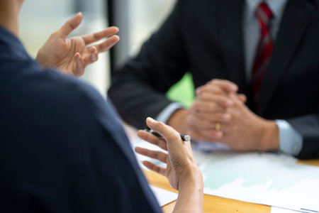 Marketing adviser meeting with the staff team to discuss market target plane from analysis data in the graph chartの写真素材