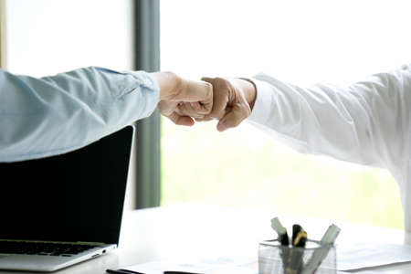 two business people use hand to fist bump for success teamwork corporate Partner Business Trust Teamwork Partnershipの写真素材