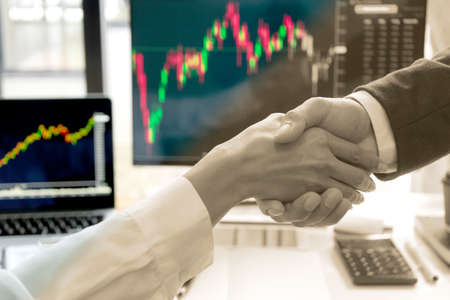 Two businessman use their hand fist bump show dealing mission business with  happy work  success teamwork top view more copy space.の写真素材