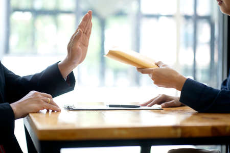 Two businessman use their hand fist bump show dealing mission business with  happy work  success teamwork top view more copy space.の写真素材