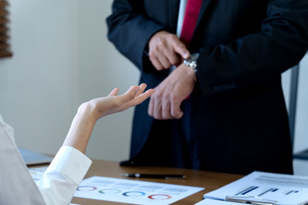 Manager showing dissatisfaction with subordinates late or late in company marketing office with graph chart and financial marketing planning information.
graph chart subordinates lateの写真素材
