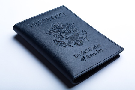 dark blue leather passport case on white background, side view.の写真素材