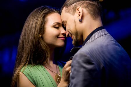 Couple in love posing on nature background.の写真素材