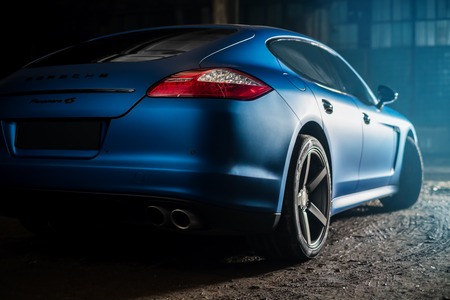 Kiev, Ukraine - 14 may 2014: Porsche Panamera blue in old factory. porsche panamera back view.のeditorial素材