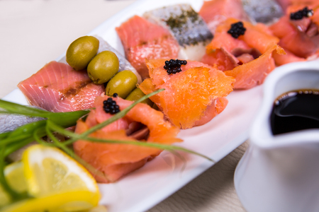salmon plate with lemon in the oriental style.の写真素材