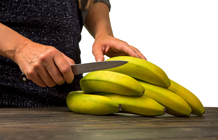 branch of bananas is on the table.の写真素材