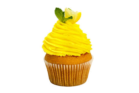 Lemon yellow cupcake with mint on a white background.の写真素材