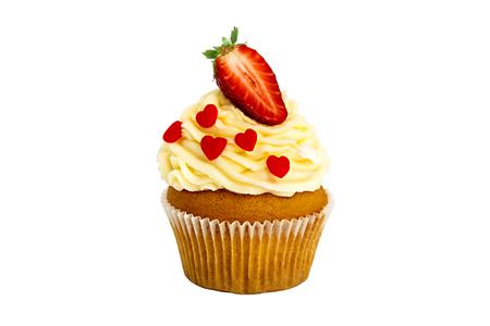 creamy sweet cupcake with a strawberry on the top on a white background.の写真素材