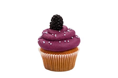 mulberry sweet cupcake with a berry on the top on a white background.の写真素材