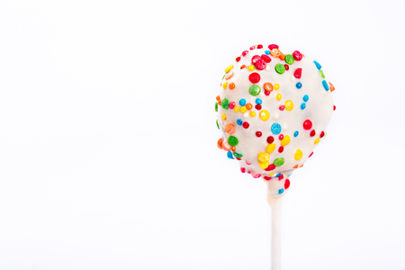 Decorating cake pop. Delicious chocolate snack on white backgroundの写真素材