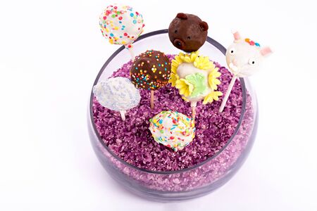 cake pops in vase isolated on white backgroundの写真素材