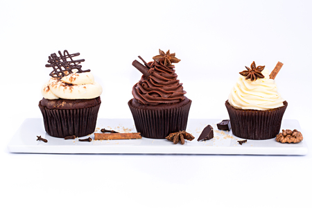 Three Chocolate sweet cupcakes on a white backgroundの写真素材