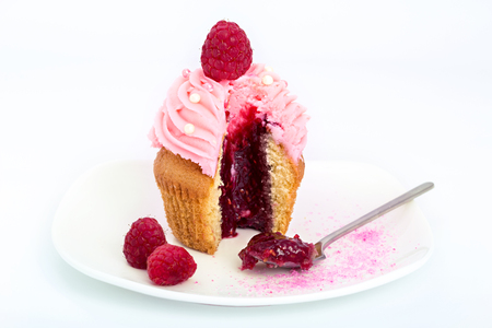 Raspberry sweet cupcake on a white background.の写真素材