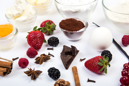 dessert ingredients and equipments on white wooden tableの写真素材