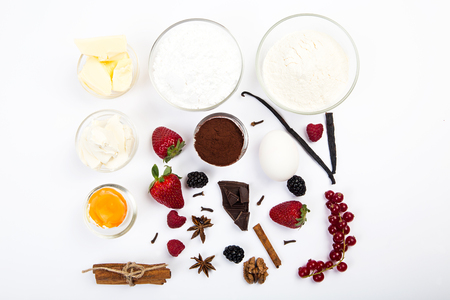 dessert ingredients and equipments on white wooden tableの写真素材