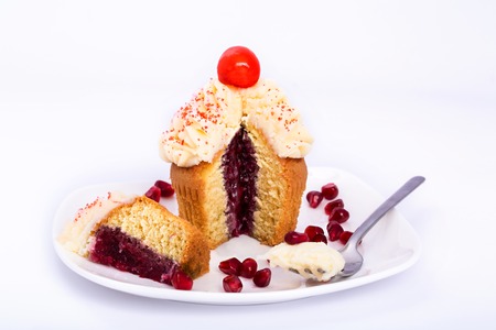 Pomegranate sweet cupcake isolated on white background.の写真素材