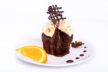 Chocolate sweet cupcake with orange on a white background.の写真素材