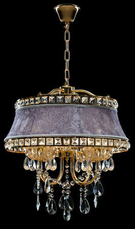 Contemporary bronze chandelier, velvet design isolated on black background. Crystal chandelierの写真素材