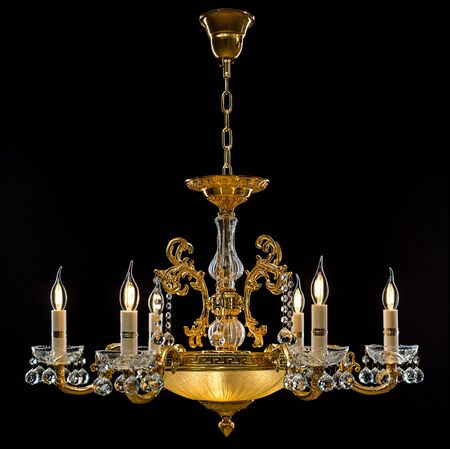 Contemporary gold chandelier isolated on black background. close-up . Crystal chandelierの写真素材