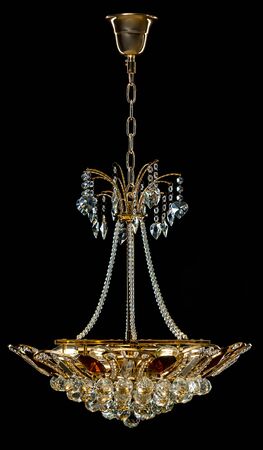 Contemporary gold chandelier isolated on black background. Crystal chandelierの写真素材