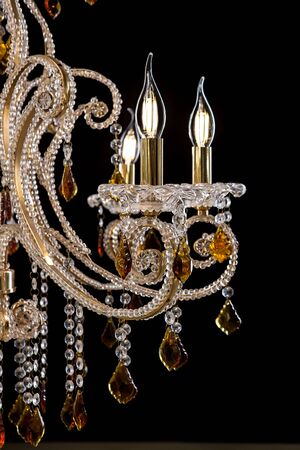 Chandelier for interior of the living room. chandelier details isolated on black background.の写真素材