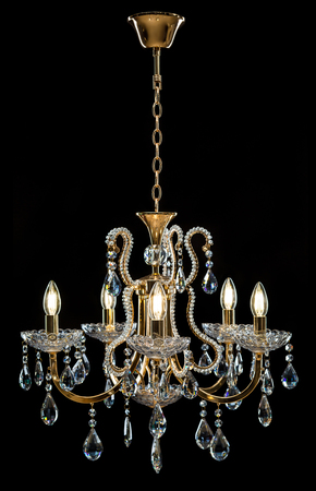 Chandelier for interior of the living room. chandelier decorated with crystals isolated on black background.の写真素材