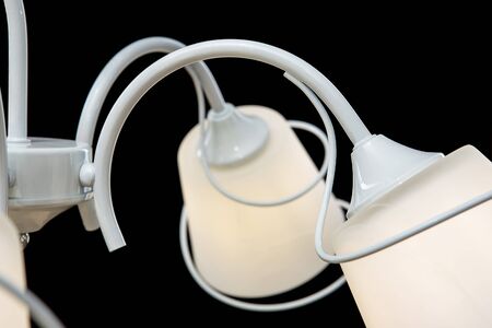 Chandelier for interior of the living room. White Chandelier close-up photo isolated on black background.の写真素材