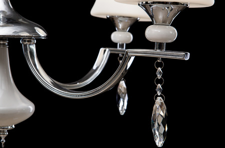 Chandelier for interior of the living room. White Chandelier close-up photo isolated on black background.の写真素材