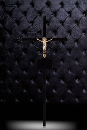Cross tombstone with Jesus isolated on dark luxury background.の写真素材