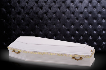 closed wooden white coffin isolated on gray luxury background. casket, coffin on royal background.の写真素材