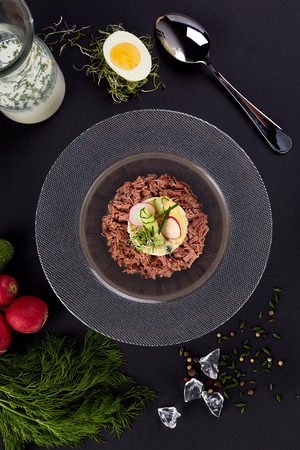 Chopped Meat with vegetables on the plate. A set of products for okroshka. Traditional Russian dish okroshka.の写真素材