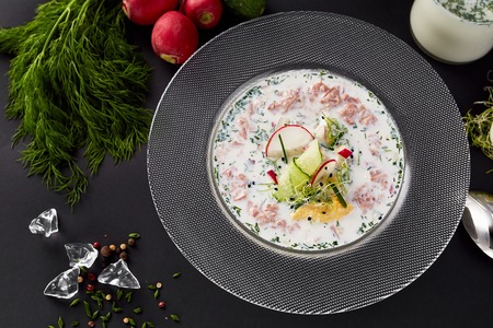 A set of products for okroshka. Traditional Russian dish okroshka on black background.