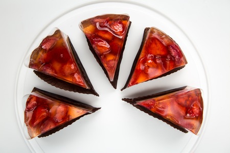 jelly cake with berries. Berry cheesecake isolated on whiteの写真素材