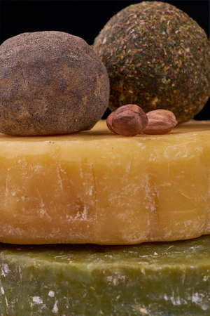 composition of cheese on wooden table. Handmade cheese on background. Homemade sheese with almondsの写真素材