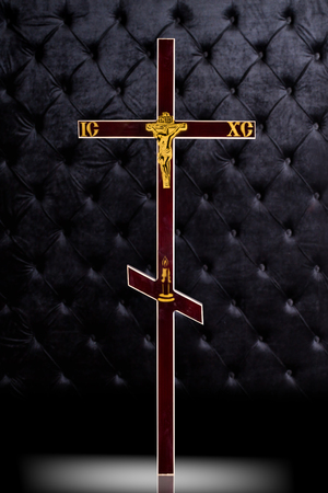 Brown wood Cross tombstone isolated on dark luxury background.の写真素材