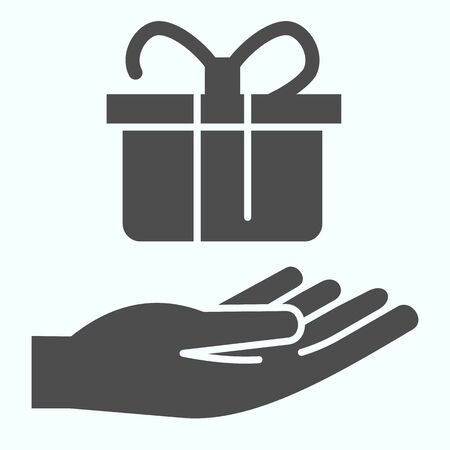 Present giving solid icon. A present on a hand vector illustration isolated on white. Giving a gift box glyph style design, designed for web and appのイラスト素材