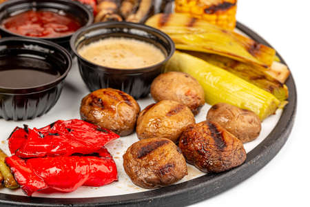 Close-up of champignons, bell peppers and leeks - fried on the grillの写真素材